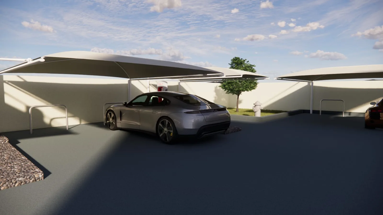 Charging bays under fabric canopies, with charge posts and protective hoops.